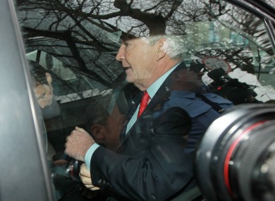 Seán FitzPatrick is driven away from Dublin District Court after being remanded on bail following charges of making misleading statements to Anglo's auditors.