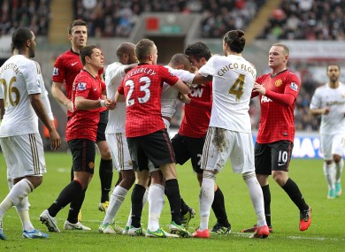 Players scuffle following the incident.