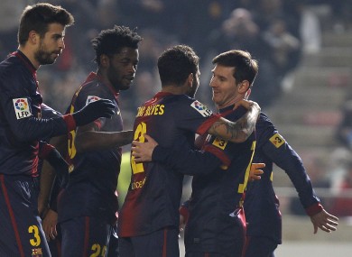 Barcelona's Lionel Messi, right, celebrates with teammates Daniel Alves, second right, Alexandre Song, second left, and Gerard Pique, left.