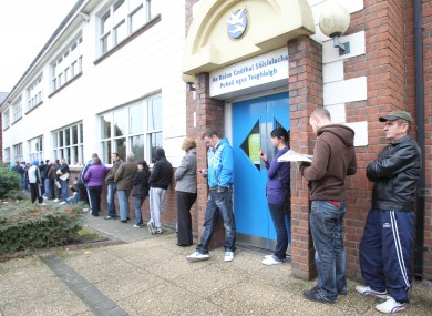 Unemployed people wait to sign on at a Social Welfare office in Finglas. 187,144 people have been on the Live Register for over twelve months.