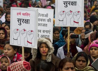 Indian women carry signs as they march to mourn the death of a gang rape victim in New Delhi, India, Wednesday, Jan 2, 2013.