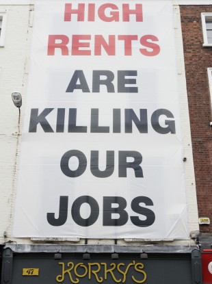 One of the banners which had previously appeared above Korky's shop.