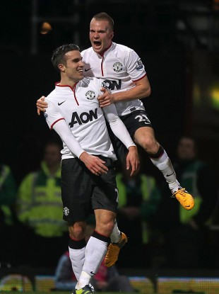 Robin van Persie celebrates with Tom Cleverley.