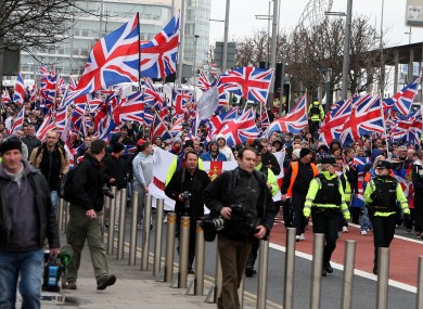 Loyalist Protestors converge on Belfast city hall earlier this month.