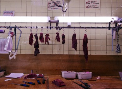 Horsemeat on hooks in a butcher shop in Paris this week
