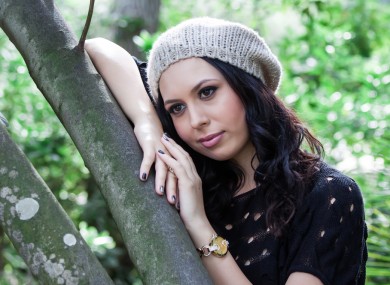 Is this girl liking leaning moodily on a tree, or not? We can't tell.