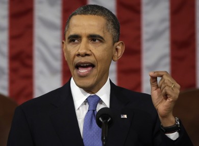 President Barack Obama gestures as he gives his State of the Union address.