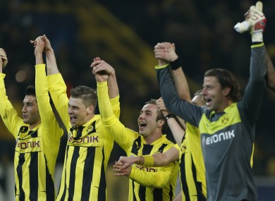 Dormund's teammates celebrate after winning the round of sixteen second leg Champions League soccer match.