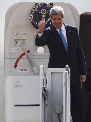 U.S. Secretary of State John Kerry gives a thumbs-up before leaving for China at the Seoul Military Airport in Seongnam, South Korea,