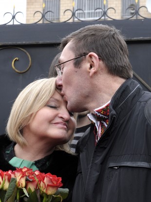 Former Ukrainian Interior Affair Minister Yuri Lutsenko kisses his wife Irina outside his prison, Sunday, April 7, 2013.