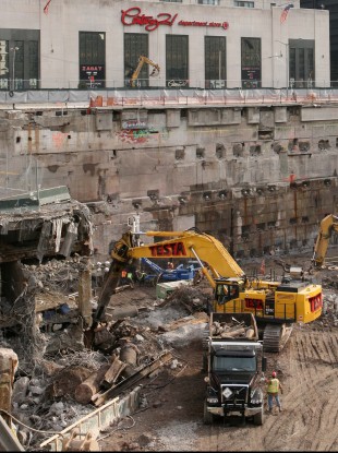 Construction workers and equipment excavate the World Trade Center site in 2008. The latest search through 9/11 debris will include materials taken from parts of the WTC site which could not previously been accessed.