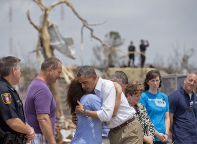 President Obama embraces a school official as he views the devastation of the Plaza Towers Elementary School in Oklahoma.