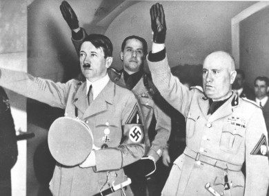 Adolf Hitler, left, and Benito Mussolini saluting during a 1938 meeting.
