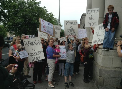 The crowd of supporters outside the High Court today
