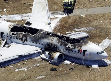 This aerial photo shows the wreckage of the Asiana Flight 214 airplane after it crashed at the San Francisco International Airport in San Francisco, Saturday, July 6, 2013.