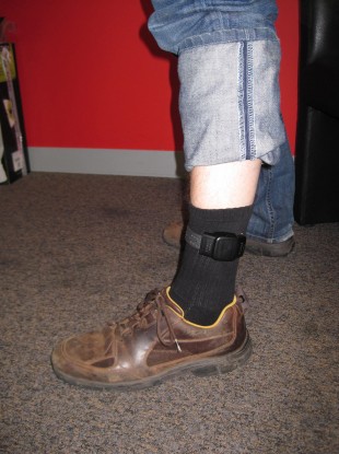 A person wearing an electronic tag.