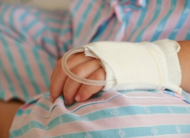 Hand of sick child in hospital