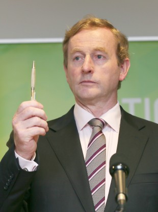 Enda Kenny with a pen.
