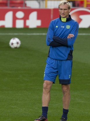 Bayer Leverkusen head coach Sami Hyypia watches as his team trains at Old Trafford Stadium last night.