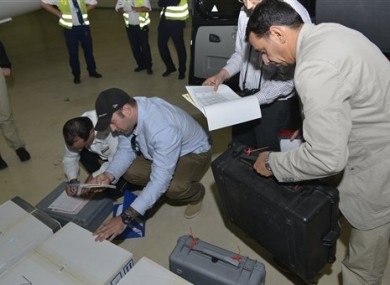 At the Organization for the Prohibition of Chemical Weapons, samples brought back by the U.N. chemical weapons inspection team are checked in upon their arrival at The Hague, Netherlands