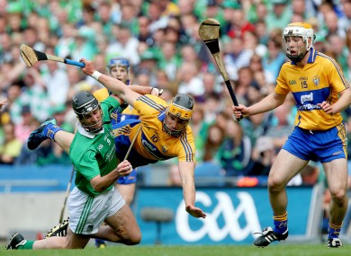 Limerick's Donal O'Grady and John Conlon of Clare battle for possession.