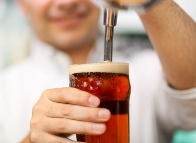 Barman pulling a pint