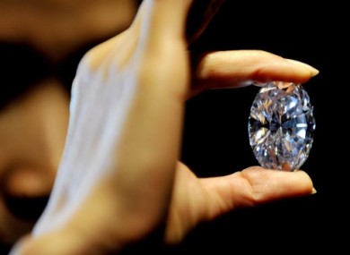 A Sotheby's employee displays the 118-carat diamond.