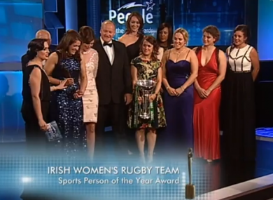Lynne Cantwell holds the Six Nations trophy as the Irish team are presented with their award.