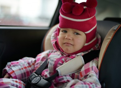 Child in car seat.