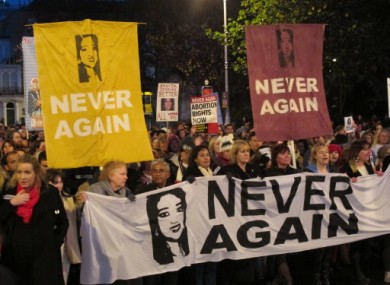 Abortion rights protesters bearing pictures of Savita Halappanavar march through central Dublin last year.