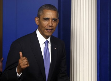President Barack Obama walks out to make a statement to reporters in the Brady Press Briefing Room at the White House in Washington last night.