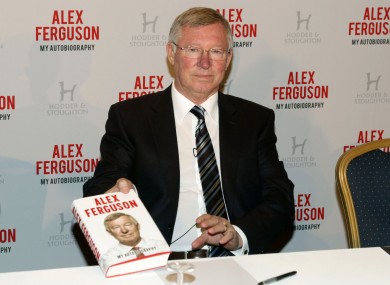 Sir Alex Ferguson with his Autobiography during the photocall at the Institute of Directors.