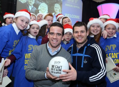 Ger Brennan and Kevin McManamon surrounded by Margaret's National School Choir at the official launch of SVP Annual Appeal.