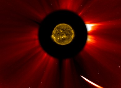 In a composite image provided by NASA, Comet ISON nears the sun.