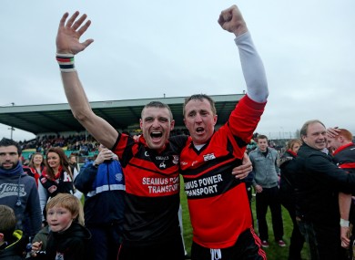 Mount Leinster's Gary Kelly and goalkeeper Frank Foley celebrate after yesterday's game.