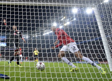 Manchester United's Chris Smalling scores during the Champions League group A game against Bayer Leverkusen last night.