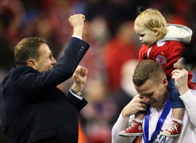 Baraclough celebrates with Danny North and his daughter Mia Grace after the game.