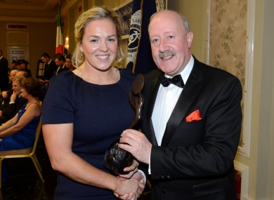 Niamh Briggs receiving her award from Garda Commissioner Martin Callinan.