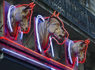 Horse head icons above a horsemeat shop in France.
