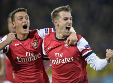 Mesut Ozil and Aaron Ramsey celebrate another day off work.