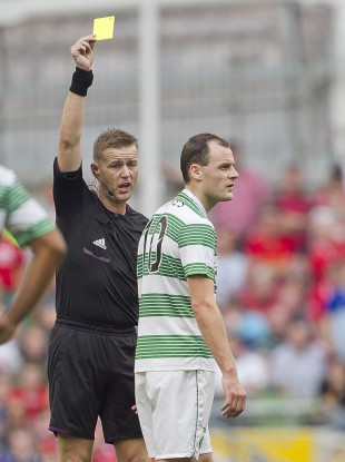 Referee Alan Kelly books Celtic striker Anthony Stokes.