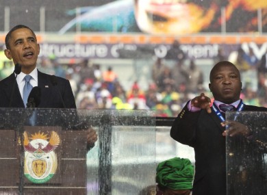 Thamsanqa Jantjie, right, interprets in sign language for President Barack Obama