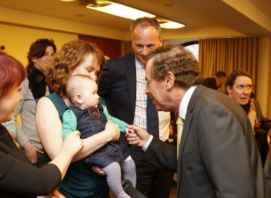Alan Shatter is pictured with 5-month-old Edie Rose Robinson Griffith and her mother Moninne Griffith.