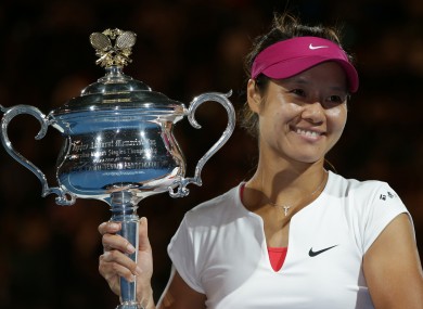 Li Na poses with the Australian Open trophy after her straight sets win.