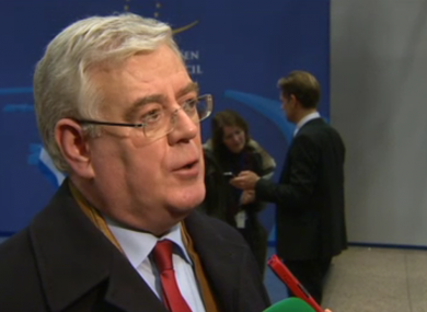 Eamon Gilmore speaks to the media on his way into the Brussels meeting
