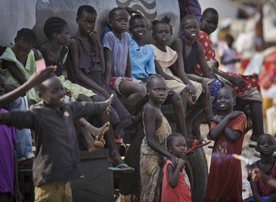 Displaced children gather on top of a truck at a United Nations compound in South Sudan.