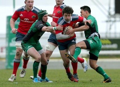 Connacht's Dave McSharry and Miah Nikora tackle Harry McNulty of Munster.