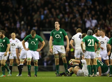 Ireland's players show their disappointment after the final whistle.