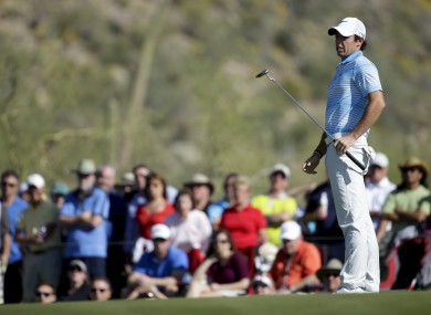Rory McIlroy reacts to his putt on the 17th hole in his match against Harris English.