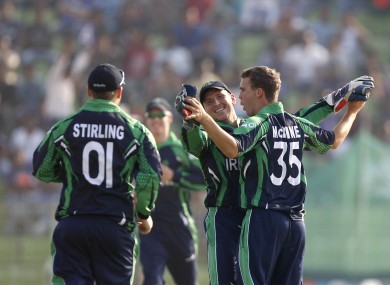 Ireland's Andy Mcbrine celebrates with Paul Stirling and William Porterfield.